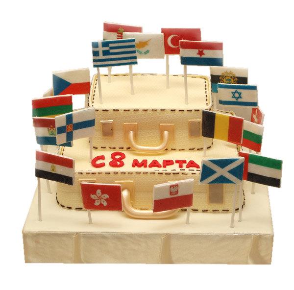 Торт чемоданы и флаги разных стран на 8 марта